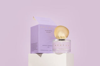 KENTRA perfume bottle and packaging on a light purple background