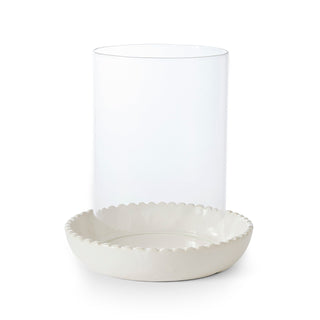 White scalloped-edge bowl with a clear glass container on a white background