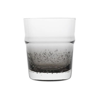 Clear glass with water and bubbles on a white background