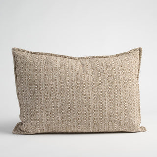Textured beige pillow on a light gray background