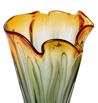 Multicolored glass vase with wavy design on a white background