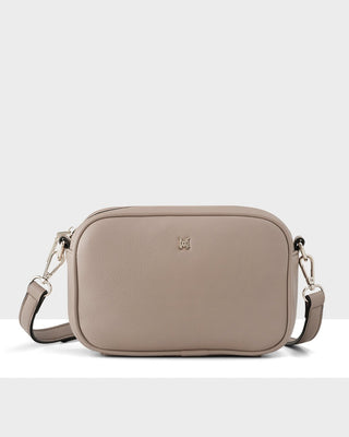 Beige crossbody bag on a white background
