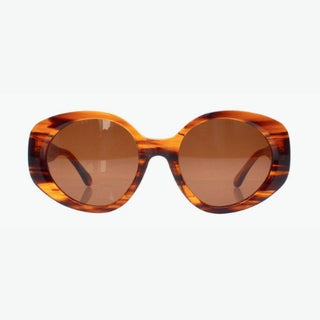 Sunglasses with tortoiseshell frame and brown lenses on a white background