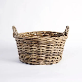 Wicker basket with handles on a white background