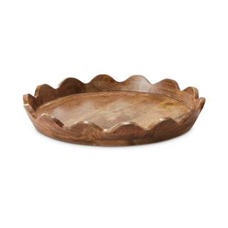 Wooden tray with scalloped edge on a white background