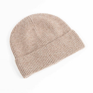 Beige knit beanie on a white background