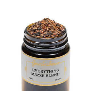 Jar of 'Everything Mezze Blend' spice mix with a visible brand name on a white background