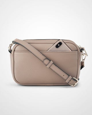 Beige crossbody bag on a light gray background