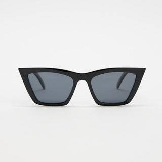 Black cat-eye sunglasses with dark lenses on a light gray background