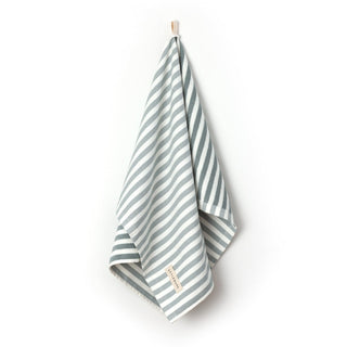 Striped towel with a brand label on a white background