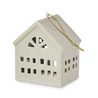 Decorative house-shaped lantern with a gold chain on a white background
