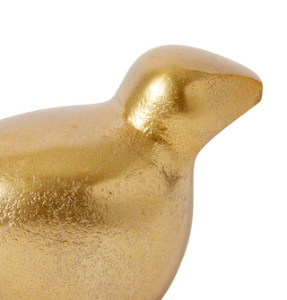 Gold bird-shaped decorative object on a white background