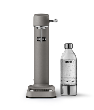 Aarke sparkling water maker and bottle on a white background