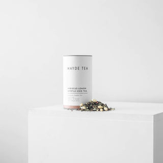 Mayde Tea Hibiscus Lemon Myrtle Iced Tea canister with loose tea on a white background