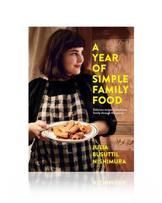 Book cover of 'A Year of Simple Family Food' with a woman holding a plate of food.