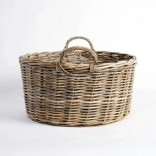 Wicker basket with handle on a white background