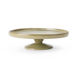 Round ceramic plate with a pedestal base on a white background
