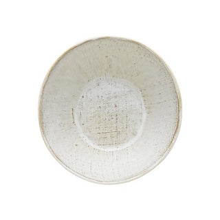 White ceramic bowl with textured surface on a white background