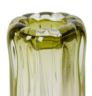Green glass vase with textured surface on a white background