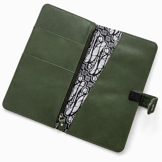 Green leather wallet with a patterned interior on a white background