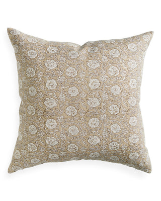 Decorative pillow with floral pattern on a beige background