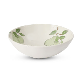 White ceramic bowl with green leaf pattern on a white background