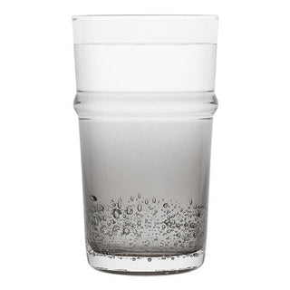 Clear glass tumbler with bubble design on a white background