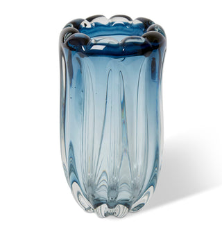 Blue glass vase with textured design on a white background