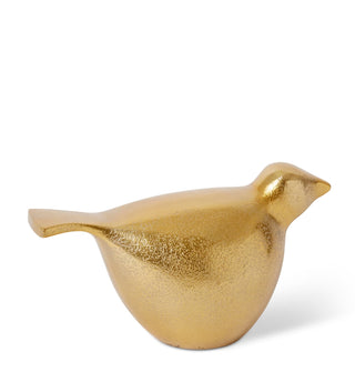 Gold bird-shaped decorative object on a white background