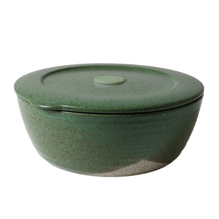 Green ceramic bowl with a lid on a white background