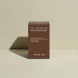 Mayde Tea box of Cacao Cinnamon Spice tea on a beige background