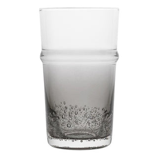 Clear glass tumbler with bubble design on a white background