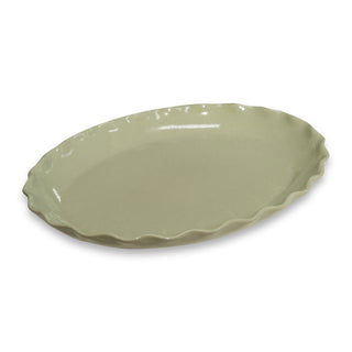 Green ceramic platter on a white background