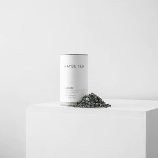Mayde Tea Cleanse canister with loose tea leaves on a white background