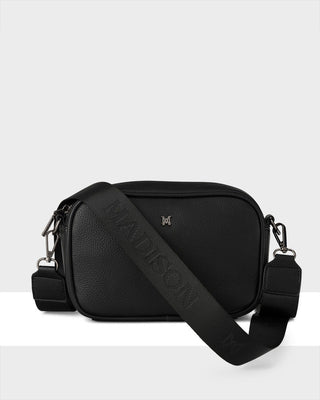 Black shoulder bag with a visible brand logo on a white background