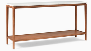 Wooden console table with a white marble top on a white background