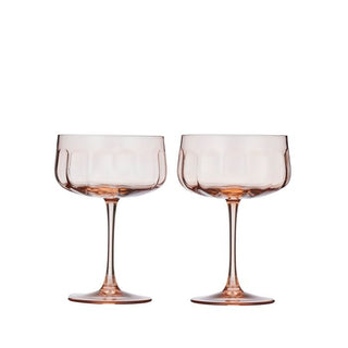 Two transparent wine glasses with a subtle tint on a white background