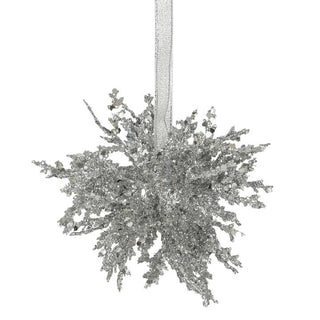 Decorative silver star ornament on a white background