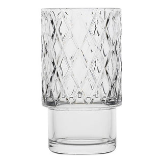Clear glass tumbler with diamond pattern on a white background