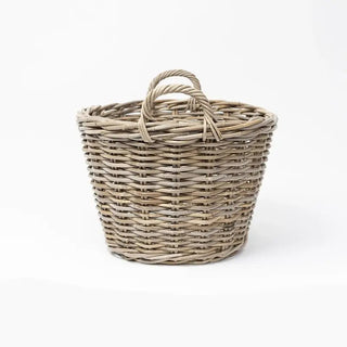 Woven basket with a handle on a white background