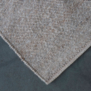 Textured fabric corner on a gray background