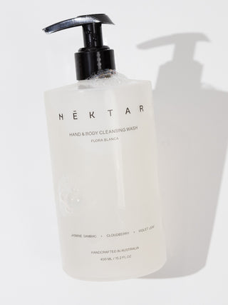 Hand and body cleansing wash bottle with pump on a white background