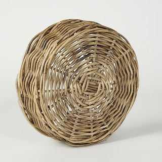 Woven rattan basket on a white background