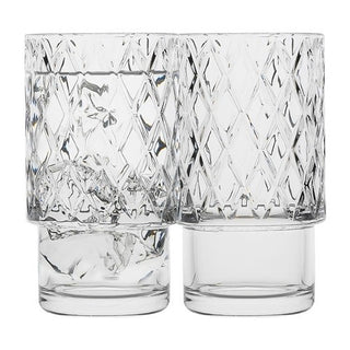 Two clear glass tumblers with diamond pattern on a white background