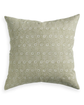 Green patterned pillow on a white background