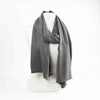 Gray scarf draped over a mannequin bust on a white background