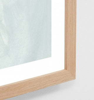 Wooden-framed mirror on a white background