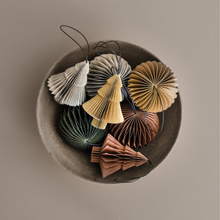 Decorative paper fans in various colors arranged in a bowl on a neutral background