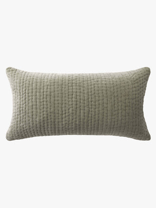 Textured green pillow on a white background