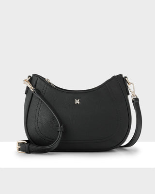 Black handbag with a visible brand logo on a white background